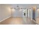Bright bedroom featuring wood-look tile floors, closet, and ceiling fan at 4463 Vieux Carre Cir, Tampa, FL 33613