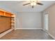 Bedroom featuring hardwood floors and walk-in closet with built-in shelving at 4463 Vieux Carre Cir, Tampa, FL 33613