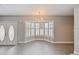 Bright dining area with tiled floors, features modern light fixture, and bay windows with plantation shutters at 4463 Vieux Carre Cir, Tampa, FL 33613