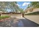 Exterior shot of the driveway and front facade including garage and walkway to front door at 4463 Vieux Carre Cir, Tampa, FL 33613
