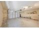Spacious two car garage with storage shelves and automatic door, awaiting the next homeowner at 4463 Vieux Carre Cir, Tampa, FL 33613