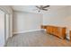 Spacious main bedroom features a ceiling fan, private door, and tiled floors, providing a serene retreat at 4463 Vieux Carre Cir, Tampa, FL 33613