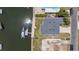Aerial view showing property lines highlighting the home, boat dock, and proximity to the water at 4464 Neptune Dr, Hernando Beach, FL 34607