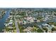 High angle, showcasing waterfront homes, each with private docks, in a tightly knit community at 4464 Neptune Dr, Hernando Beach, FL 34607