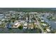 Panoramic aerial perspective of a waterfront neighborhood, showing many docks and residential houses at 4464 Neptune Dr, Hernando Beach, FL 34607