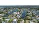 Aerial view of home's location in residential canal community with easy access to waterways and nearby amenities at 4464 Neptune Dr, Hernando Beach, FL 34607
