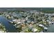 High angle, showcasing waterfront homes, each with private docks, in a tightly knit community at 4464 Neptune Dr, Hernando Beach, FL 34607