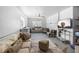 Spacious basement area with multiple seating areas, a TV, and tile flooring at 4464 Neptune Dr, Hernando Beach, FL 34607