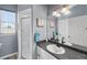 Bathroom featuring a granite countertop, seahorse artwork, and walk-in shower at 4464 Neptune Dr, Hernando Beach, FL 34607