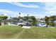 Beautiful canal view with private boat dock and lush green lawn at 4464 Neptune Dr, Hernando Beach, FL 34607