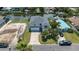 Inviting waterfront home featuring a well-manicured lawn and private dock access on a sunny day at 4464 Neptune Dr, Hernando Beach, FL 34607