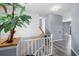 Hallway with stairs features modern decor and leads to other areas of the home at 4464 Neptune Dr, Hernando Beach, FL 34607