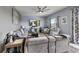 Bright and spacious living room boasts a large sectional, modern ceiling fan, and stylish decor for comfortable living at 4464 Neptune Dr, Hernando Beach, FL 34607