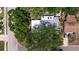 Overhead view showcasing the property's roof and beautiful tree coverage in a serene residential neighborhood at 4609 S Shamrock Rd, Tampa, FL 33611
