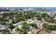 Suburban aerial view showcasing the house's location amid tree-lined streets and nearby urban conveniences at 4609 S Shamrock Rd, Tampa, FL 33611