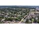 An aerial view showing a neighborhood with tree-lined streets and well-maintained homes. The cityscape is visible in the distance at 4609 S Shamrock Rd, Tampa, FL 33611