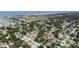 Aerial view showcases a residential community near a body of water, with lush greenery and well-maintained properties at 4609 S Shamrock Rd, Tampa, FL 33611