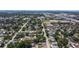 An aerial view showcasing a neighborhood with tree-lined streets and a mix of homes with a view of the water at 4609 S Shamrock Rd, Tampa, FL 33611