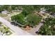 An aerial view showcasing the home's location on a corner lot with mature tree coverage at 4609 S Shamrock Rd, Tampa, FL 33611