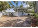 Spacious backyard showcasing the covered patio and the overall outdoor living space at 4609 S Shamrock Rd, Tampa, FL 33611