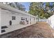 Large, open backyard with a covered patio, ideal for entertaining or relaxing outdoors at 4609 S Shamrock Rd, Tampa, FL 33611