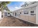 Expansive backyard featuring a covered patio with comfortable seating and a convenient storage shed at 4609 S Shamrock Rd, Tampa, FL 33611