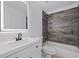 Bathroom with a modern vanity, a tub, and stylish tile details in the shower area at 4609 S Shamrock Rd, Tampa, FL 33611