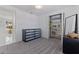 A bedroom featuring a closet with shelving, bright window and carpet flooring at 4609 S Shamrock Rd, Tampa, FL 33611