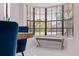 Close up of dining area with view of exterior and bench seating near a bright window at 4609 S Shamrock Rd, Tampa, FL 33611