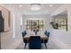 Formal dining room with bay windows, chandelier and seating for six is perfect for entertaining guests at 4609 S Shamrock Rd, Tampa, FL 33611