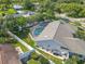 Aerial view of backyard with screened pool and white fence surrounding the property at 465 Holly Hill Rd, Oldsmar, FL 34677