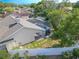 Aerial view showcasing the private, fenced backyard with a screened-in pool and lush landscaping at 465 Holly Hill Rd, Oldsmar, FL 34677