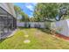 Lush backyard featuring a stepping stone path and mature landscaping, perfect for outdoor relaxation at 465 Holly Hill Rd, Oldsmar, FL 34677