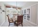 Cozy breakfast nook with bay window and view of outdoor pool at 465 Holly Hill Rd, Oldsmar, FL 34677