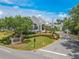 An exterior view of the Ardea Country Club Entrance surrounded by meticulously maintained landscaping and beautiful trees at 465 Holly Hill Rd, Oldsmar, FL 34677