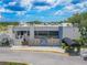 A close, exterior view of Ardea Country Club building with manicured landscaping and parking out front at 465 Holly Hill Rd, Oldsmar, FL 34677