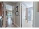 Hallway view into bathroom with tub and shower to the right, and bedroom to the left at 465 Holly Hill Rd, Oldsmar, FL 34677