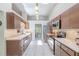 Well-lit kitchen featuring ample counter space, stainless steel appliances, and a skylight at 465 Holly Hill Rd, Oldsmar, FL 34677
