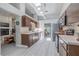 Kitchen area with stainless appliances, cabinetry, and views to other living spaces at 465 Holly Hill Rd, Oldsmar, FL 34677