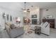 Comfortable living room featuring a fireplace, cozy seating, and a ceiling fan for added comfort at 465 Holly Hill Rd, Oldsmar, FL 34677