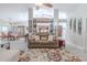 Cozy living area flowing into the dining room, featuring neutral paint and hardwood flooring at 465 Holly Hill Rd, Oldsmar, FL 34677