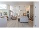 Open living room with light-colored floors, a ceiling fan, and views into other rooms at 465 Holly Hill Rd, Oldsmar, FL 34677