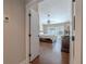Entryway into the main bedroom with ceiling fan, wood floors, and view of the pool at 465 Holly Hill Rd, Oldsmar, FL 34677