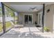 Covered patio featuring ceiling fan and comfortable seating, ideal for relaxation and outdoor enjoyment at 465 Holly Hill Rd, Oldsmar, FL 34677