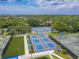 Aerial view of the Ardea Country Club's Pickleball Courts with lush green trees surrounding the area at 465 Holly Hill Rd, Oldsmar, FL 34677
