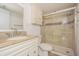 Updated bathroom featuring a modern vanity, glass shower, and tiled accents at 4708 Michael Ct # 103, Tampa, FL 33614