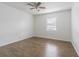 Bright bedroom with wood-look floors and a ceiling fan for added comfort at 4708 Michael Ct # 103, Tampa, FL 33614
