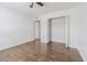 Bedroom featuring wood-look flooring and an open closet space at 4708 Michael Ct # 103, Tampa, FL 33614