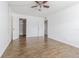 Bright bedroom features hardwood floors, ceiling fan, and a large closet at 4708 Michael Ct # 103, Tampa, FL 33614