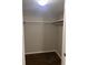A walk-in closet with built-in shelving provides ample storage for all of your wardrobe needs at 4708 Michael Ct # 103, Tampa, FL 33614